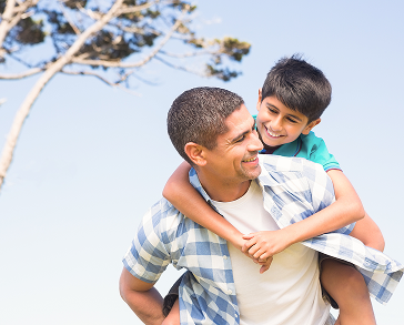 Father and son smiling