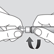 Hands twisting the plunger rod into the MixPro® syringe