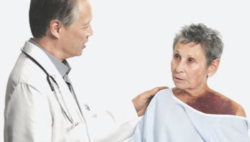 Doctor with their hand on their AH patient's shoulder