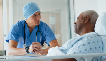 HCP talking with patient in the hospital