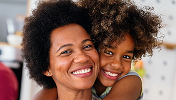 Mother and child smiling