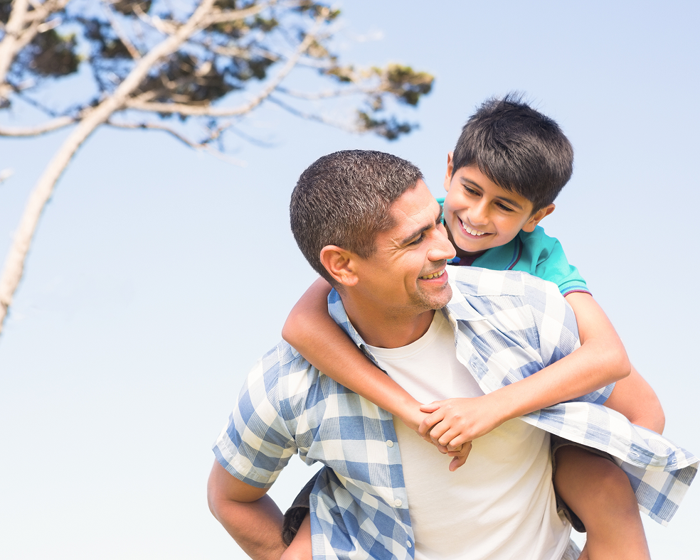 Father and son smiling